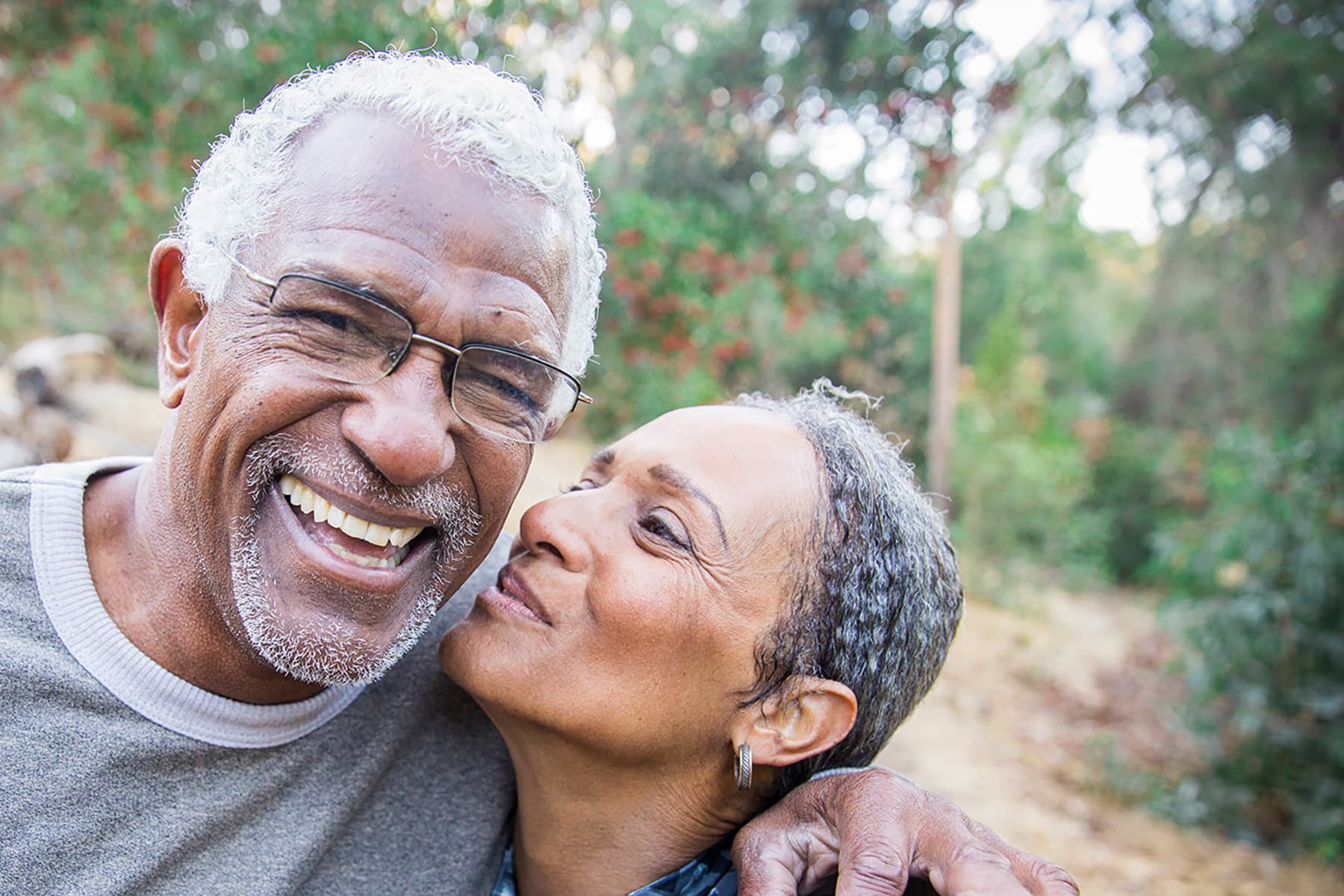 Confident patient with a complete smile after single dental implant